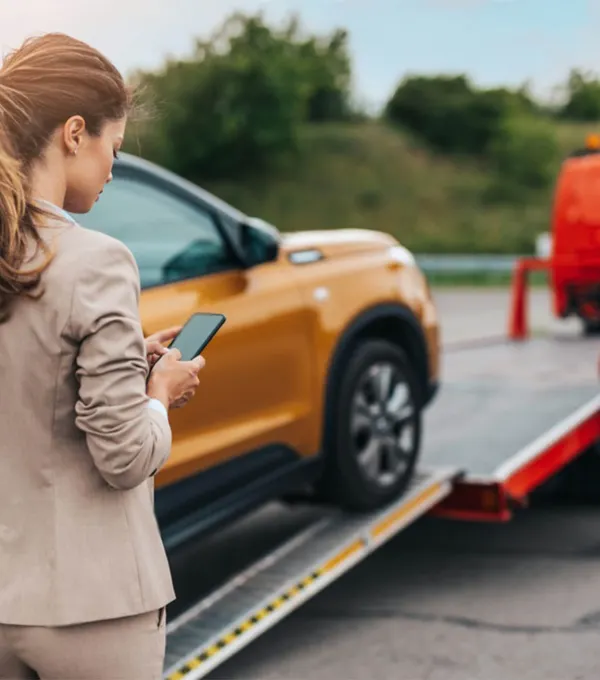 Driver using roadside towing service